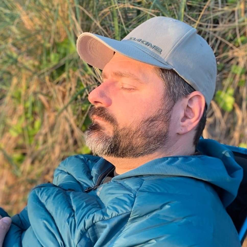 Chris Drake outdoors in warm evening light